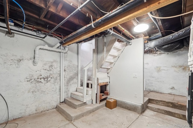 unfinished basement with stairs