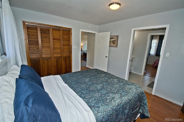 246 Baca Grant Way, Crestone, CO 81131 - bedroom featuring a closet, wood finished floors, and baseboards