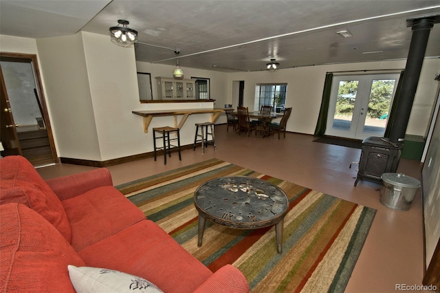 246 Baca Grant Way, Crestone, CO 81131 - living area with a wood stove and french doors