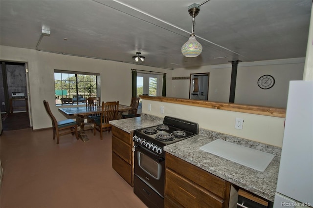 246 Baca Grant Way, Crestone, CO 81131 - kitchen with pendant lighting, light stone countertops, and black range with electric stovetop