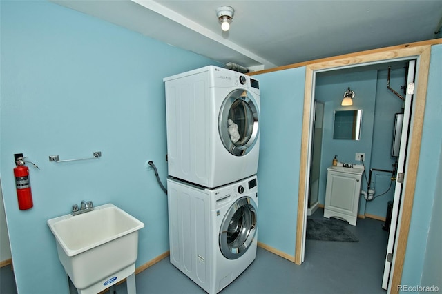 246 Baca Grant Way, Crestone, CO 81131 - clothes washing area featuring laundry area, stacked washer / dryer, and a sink