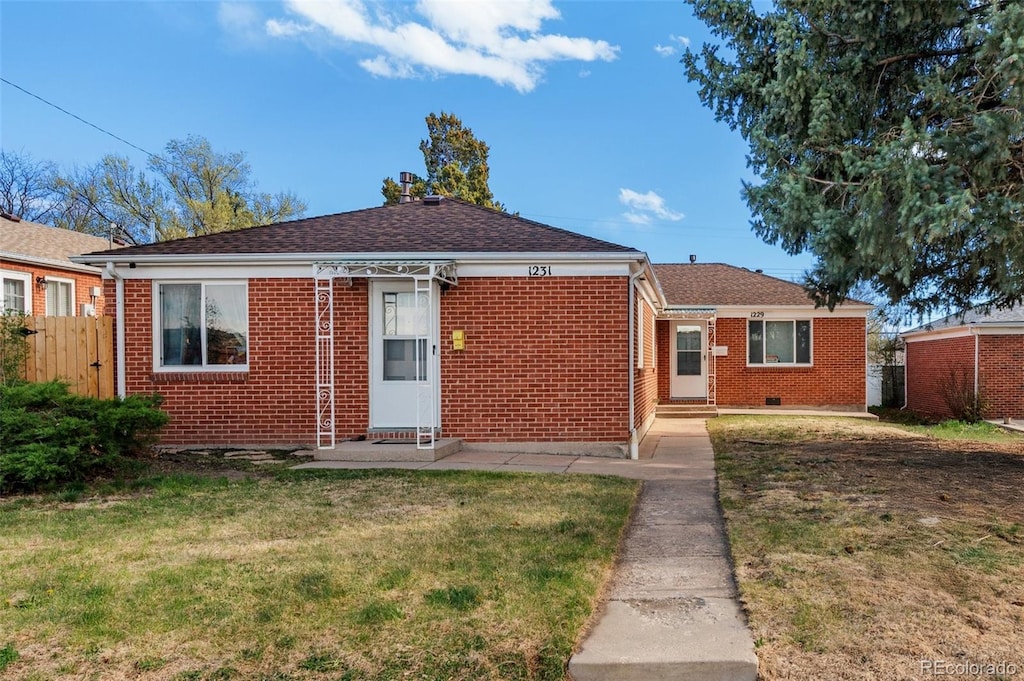 1229 E Caramillo St, Colorado Springs, CO 80909 - bungalow with entry steps, brick siding, and roof with shingles