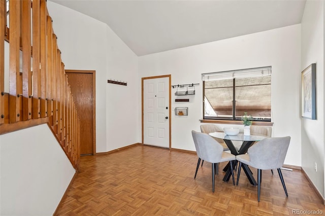 501 Manhattan Dr Unit 202, Boulder, CO 80303 - dining room with baseboards and high vaulted ceiling