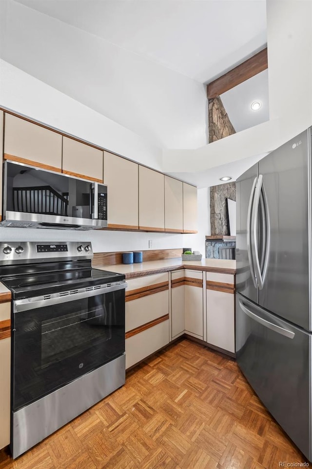 501 Manhattan Dr Unit 202, Boulder, CO 80303 - kitchen featuring appliances with stainless steel finishes, light countertops, and recessed lighting