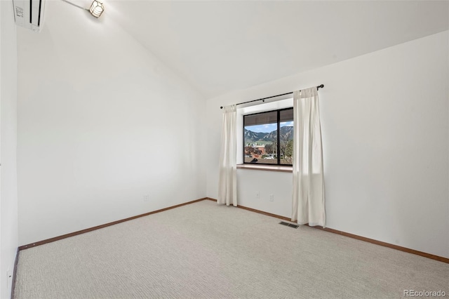 501 Manhattan Dr Unit 202, Boulder, CO 80303 - unfurnished room with lofted ceiling, light carpet, and baseboards