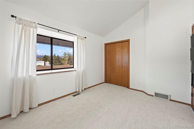 501 Manhattan Dr Unit 202, Boulder, CO 80303 - unfurnished bedroom with carpet flooring, baseboards, and high vaulted ceiling