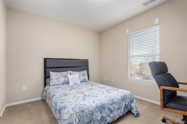 bedroom with light carpet