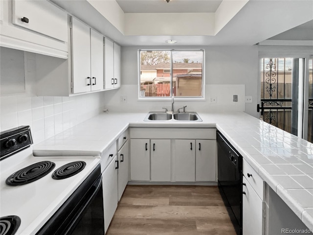 kitchen with sink, backsplash, dishwasher, stove, and hardwood / wood-style floors