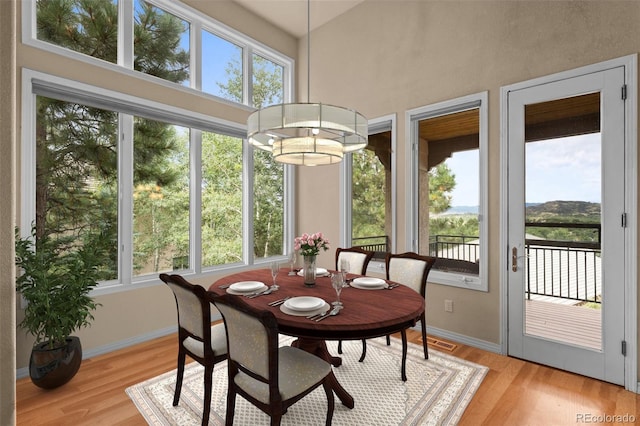 sunroom with a chandelier