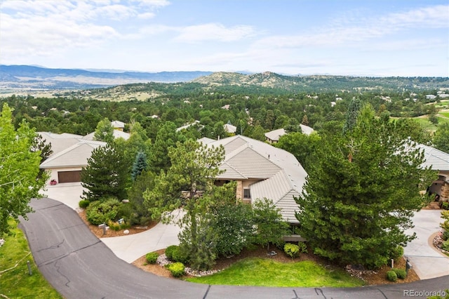 birds eye view of property featuring a mountain view