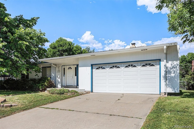 6019 Taft Ct, Arvada, CO 80004 - single story home with a front yard, concrete driveway, a garage, and a chimney