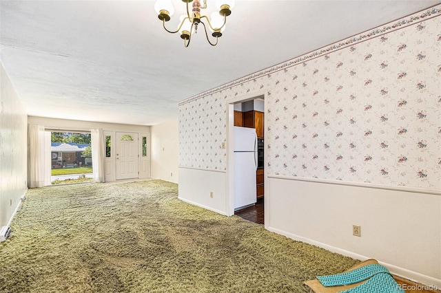 6019 Taft Ct, Arvada, CO 80004 - spare room with wallpapered walls, a chandelier, carpet flooring, and wainscoting