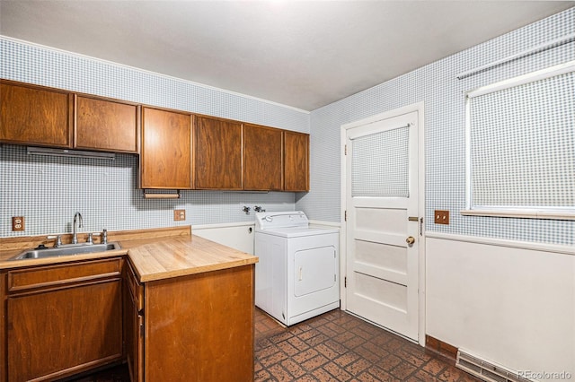 6019 Taft Ct, Arvada, CO 80004 - laundry room featuring washer / clothes dryer, cabinet space, and wallpapered walls