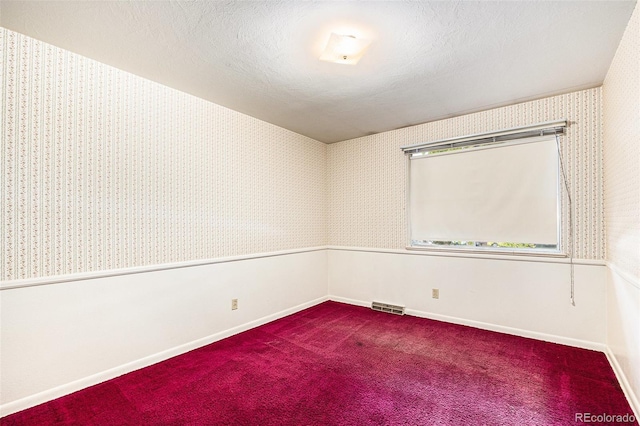 6019 Taft Ct, Arvada, CO 80004 - spare room with dark colored carpet and wallpapered walls