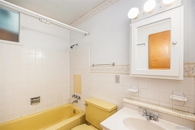 6019 Taft Ct, Arvada, CO 80004 - full bathroom featuring  shower combination, tile walls, and vanity