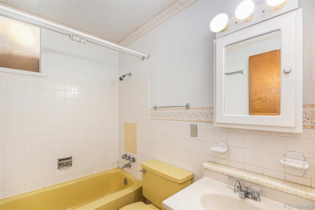 6019 Taft Ct, Arvada, CO 80004 - full bath featuring tub / shower combination, tile walls, and vanity