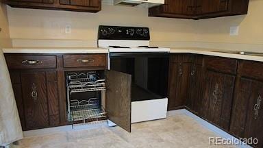 6485 Yvonne Way, Colorado Springs, CO 80918 - kitchen featuring white electric range oven, dark brown cabinets, and light countertops