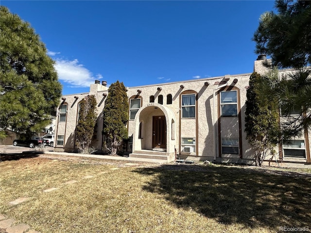 6485 Yvonne Way, Colorado Springs, CO 80918 - view of front of house with a front yard and stucco siding