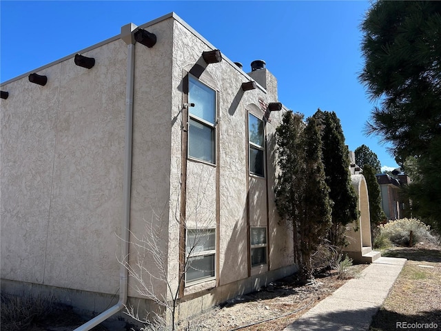 6485 Yvonne Way, Colorado Springs, CO 80918 - view of side of home featuring stucco siding