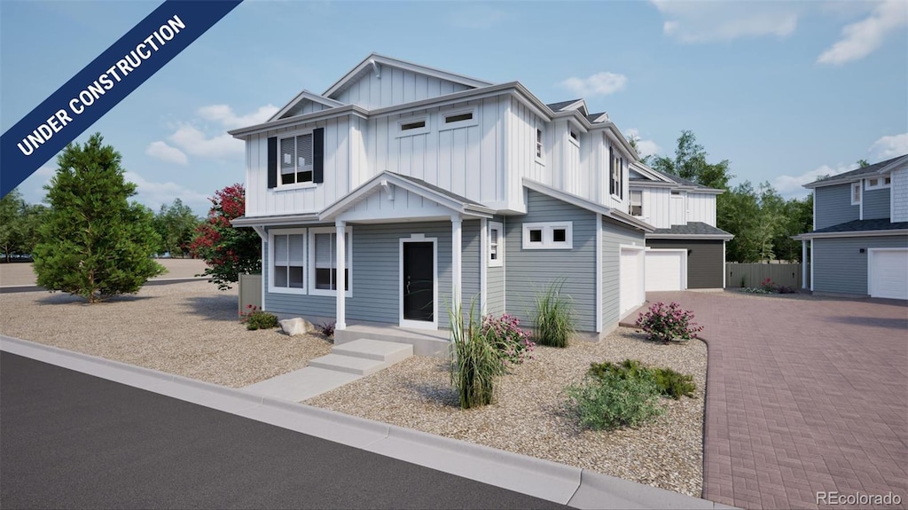46549 Sunflower Ln, Bennett, CO 80102 - modern inspired farmhouse with board and batten siding, covered porch, decorative driveway, and an attached garage