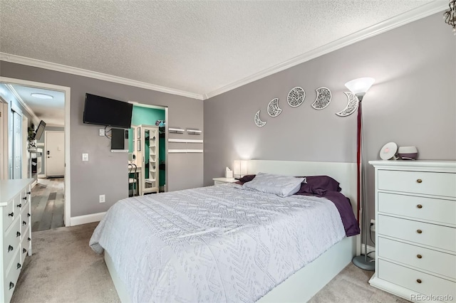 bedroom with ornamental molding, a spacious closet, light carpet, and a textured ceiling