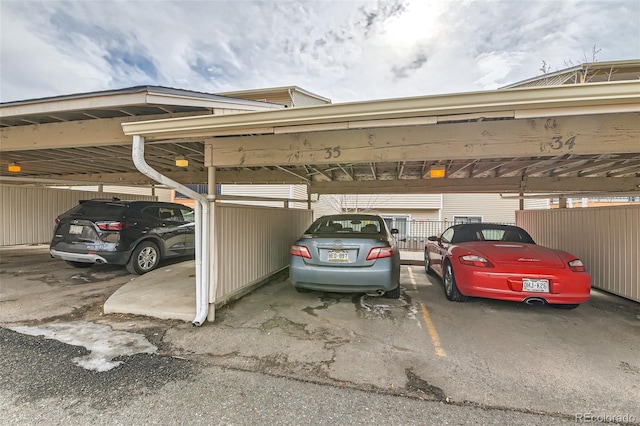 view of parking / parking lot featuring a carport