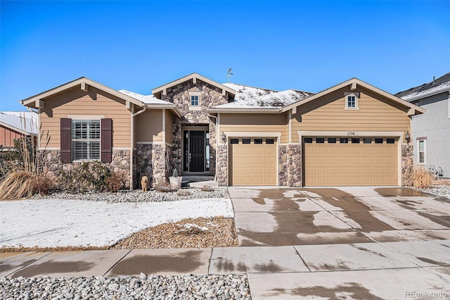 view of front of property featuring a garage, stone siding, and concrete driveway