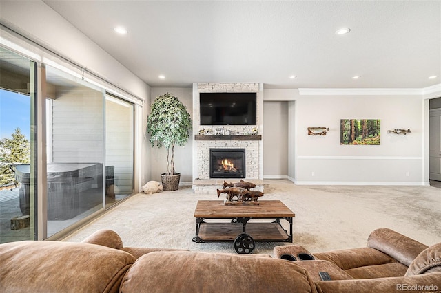 living area with recessed lighting, a fireplace, baseboards, and carpet floors