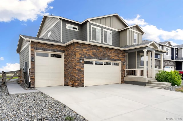 4209 Fox Grove Dr, Fort Collins, CO 80524 - craftsman house featuring stone siding, a porch, board and batten siding, and concrete driveway