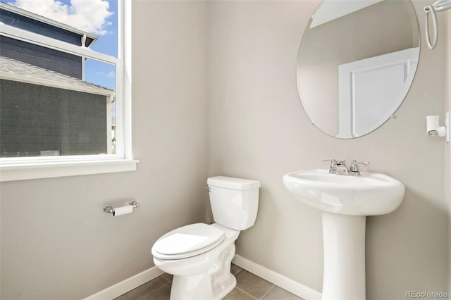 4209 Fox Grove Dr, Fort Collins, CO 80524 - bathroom with toilet, baseboards, tile patterned flooring, and healthy amount of natural light