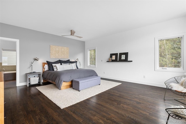 bedroom with baseboards and wood finished floors