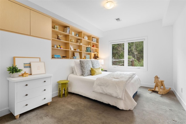 bedroom featuring light colored carpet, visible vents, and baseboards