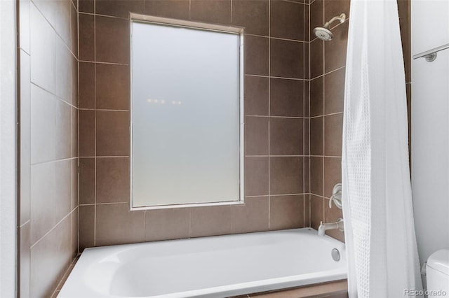 bathroom featuring shower / bath combination with curtain