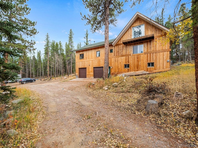 view of side of home with a garage