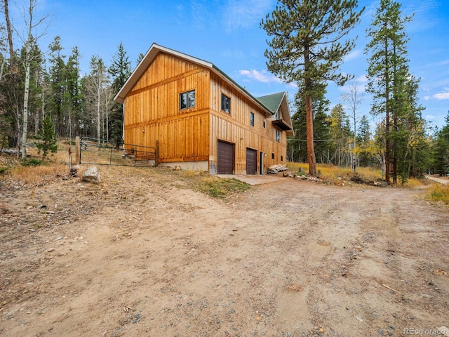 view of side of home with a garage