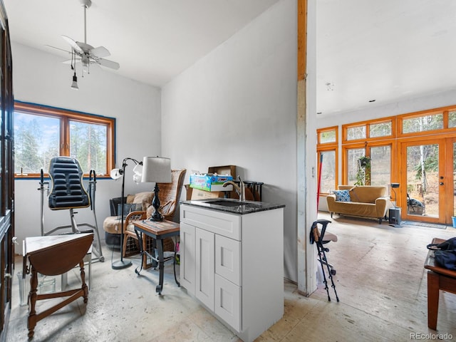 office area with ceiling fan and sink