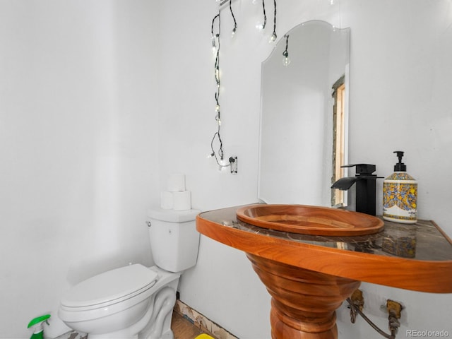 bathroom with toilet and sink