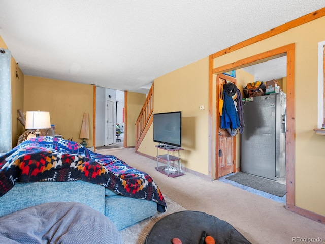 bedroom featuring light carpet, a closet, and stainless steel fridge with ice dispenser