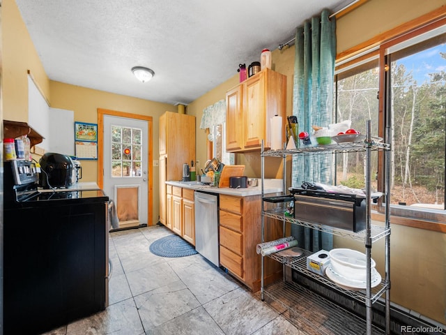 kitchen featuring light brown cabinetry, black electric range oven, a textured ceiling, and stainless steel dishwasher