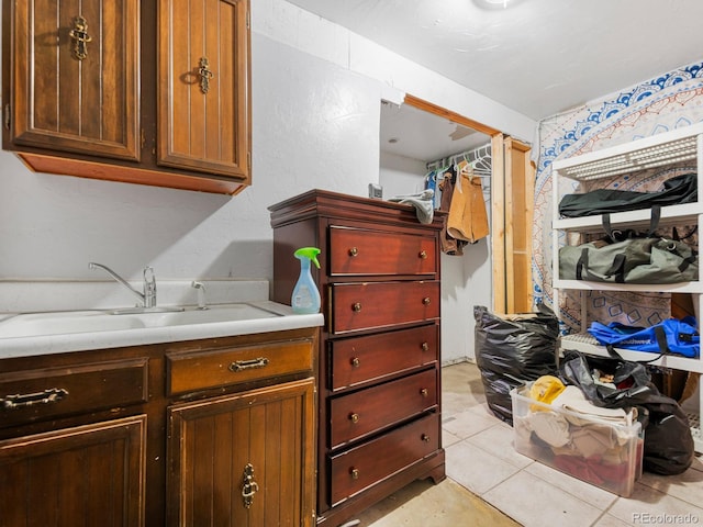 interior space featuring vanity and tile patterned floors