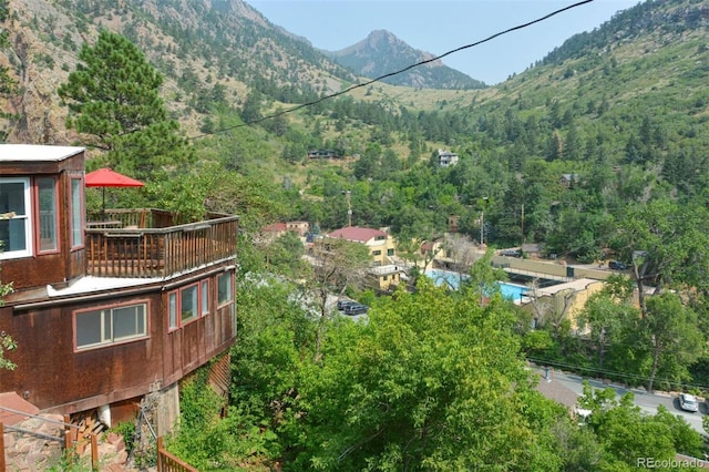 property view of mountains featuring a view of trees