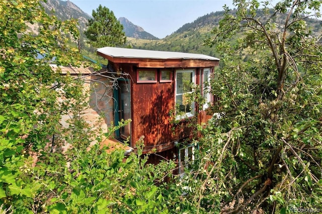 view of outbuilding featuring a mountain view