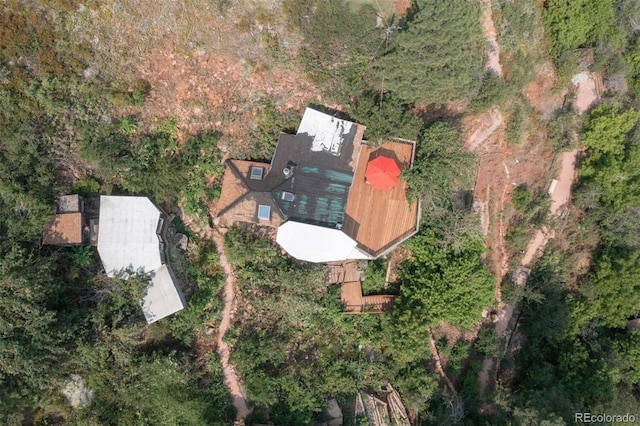 aerial view featuring a wooded view