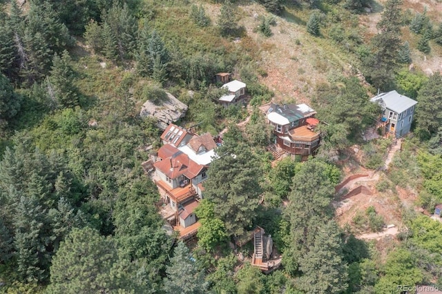 aerial view featuring a wooded view