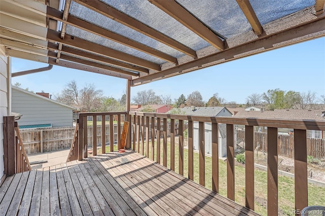 wooden terrace featuring a fenced backyard