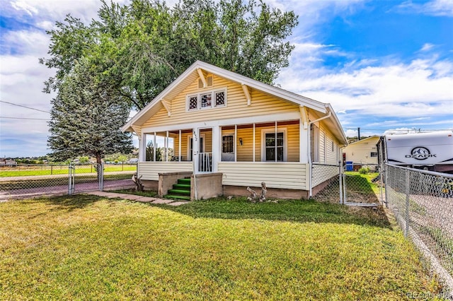 bungalow-style house with covered porch and a front yard