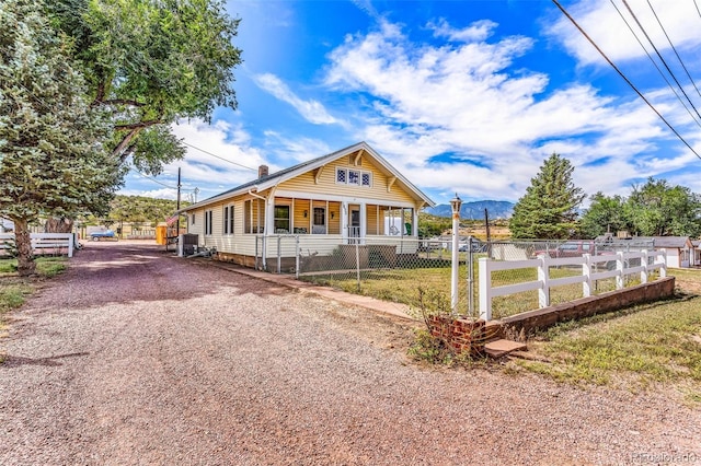 view of front of house featuring a front lawn and a porch