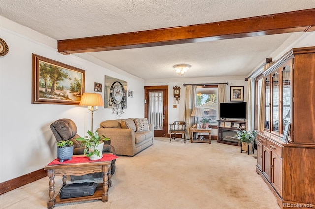 living room featuring beamed ceiling, light colored carpet, and a textured ceiling