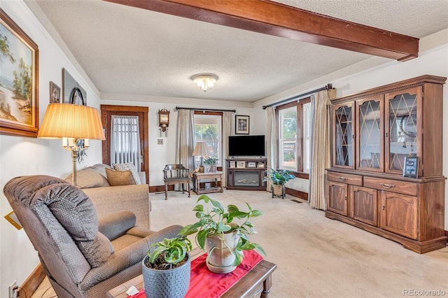 living room with light carpet, a textured ceiling, and beamed ceiling