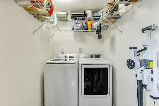 washroom featuring washing machine and dryer